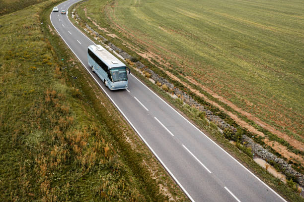 istock White bus on the highway at dusk 1346556764