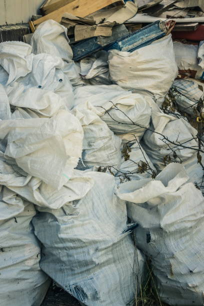 istock White construction garbage bags. Construction garbage bags piled on top of one another. A large pile of construction garbage bags. abstract background 1346560440