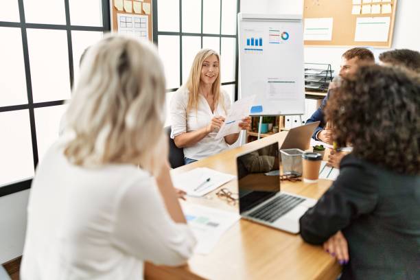 istock Group of business workers working at the office. 1346560510