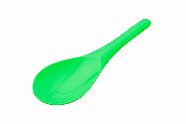 istock Beautiful green plastic melamine ladle or spoon for kitchenware 1346563033