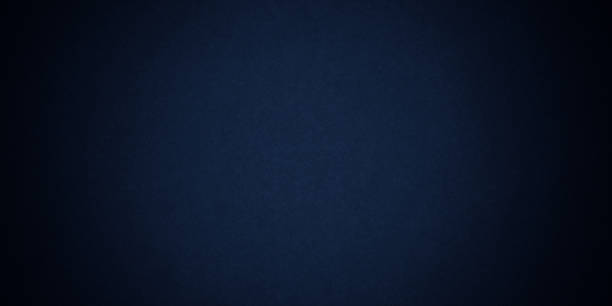 istock Dark blue background texture with black vignette in old vintage grunge textured border design, dark elegant teal color wall with light spotlight center 1346563660