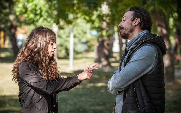 istock Young couple in quarrel conflict, pointing each other with finger 1346566038