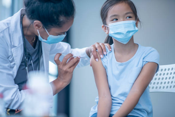 istock Young Girl Receiving a Vaccination 1346566680