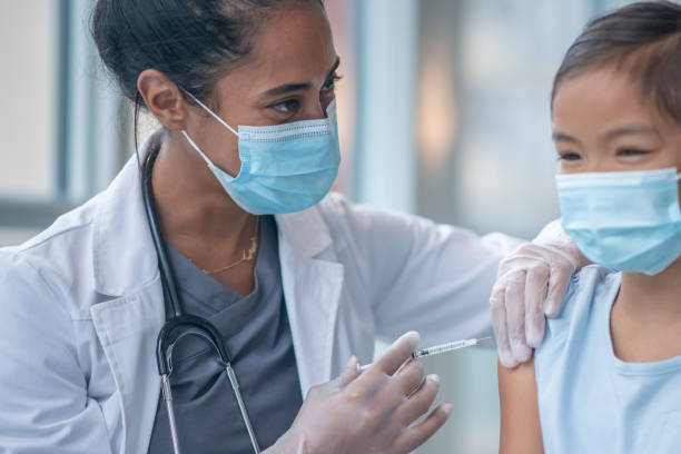 istock Young Girl Receiving a Vaccination 1346566697