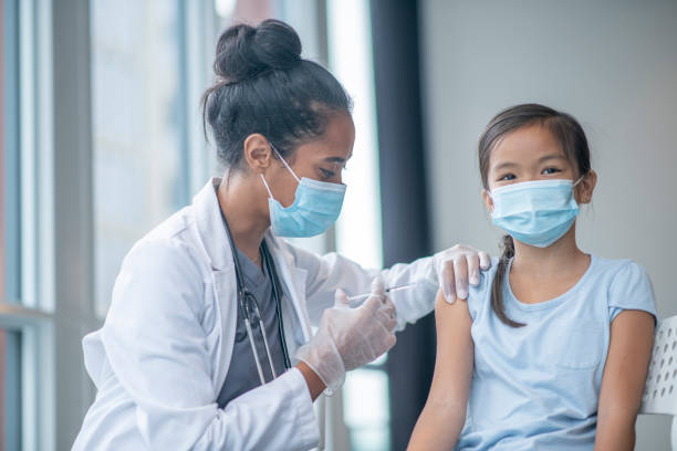 istock Young Girl Receiving a Vaccination 1346566705