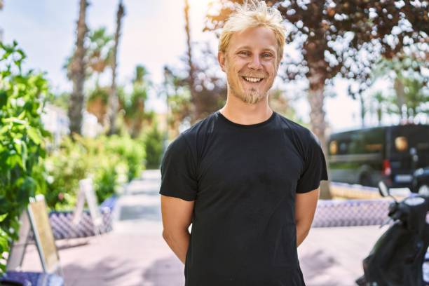 istock Young caucasian man smiling confident at street 1346568759