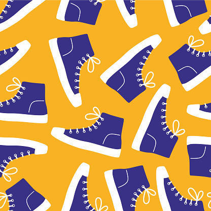 Shoe pair, boots, footwear. Canvas shoes. Сolor seamless pattern on yellow background.