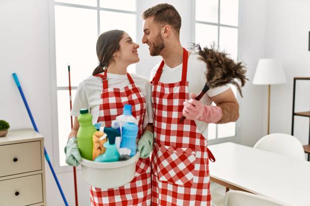 istock Young caucasian couple cleaning at home. 1346570794