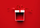Open White Gift Box Tied With Red Heart Shaped Ribbon Sitting Over Red  Background