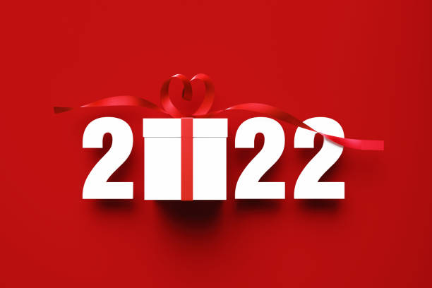 istock 2022 And White Gift Box Sitting Over Red Background 1346571917