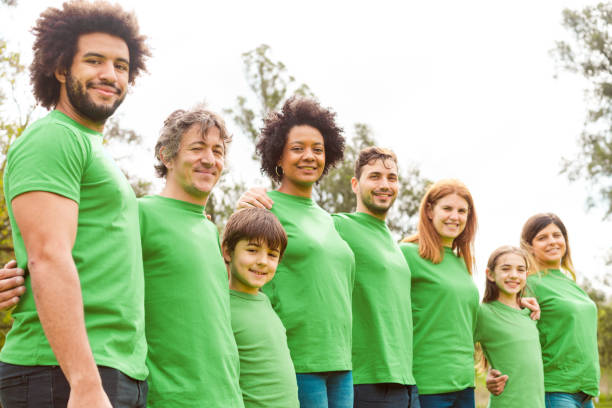 istock Volunteers at park during environmental cleanup 1346571920