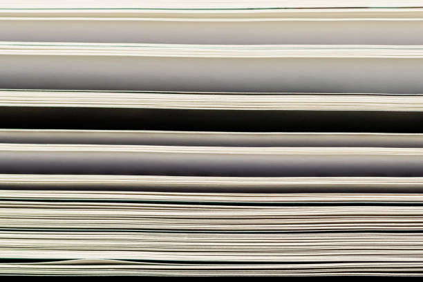 istock Open book pages close-up. Modern background. Education, school, reading concept 1346571971