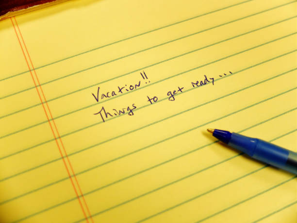 istock Notebook with Vacation things to get ready written to help with planning 1346573270