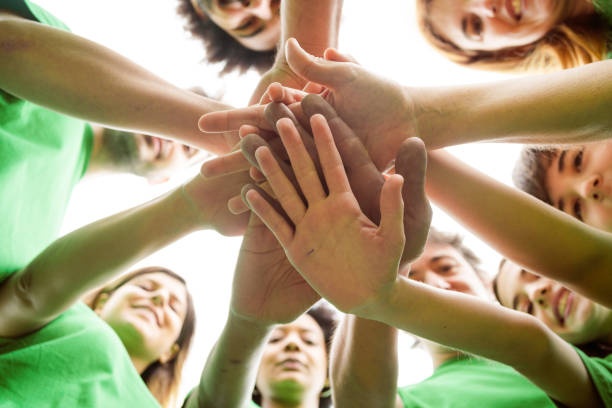 istock Volunteers doing environmental cleanup together 1346573355