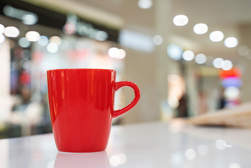 Red modern tea mug Blurred bokeh background with Red  tea mug