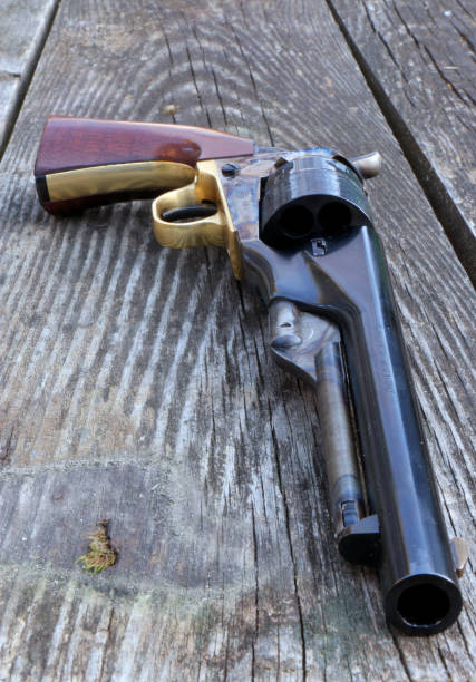 istock Black powder revolver on an old board 1346575191