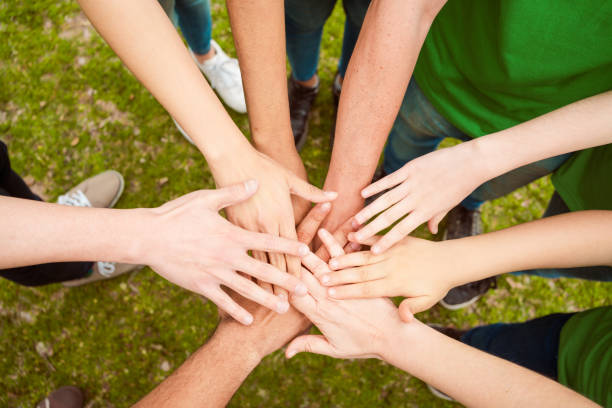 istock Volunteers in park during environmental cleanup 1346575300