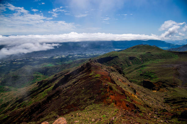 istock Scenic high angle view on mountains, Aso town, and volcanic soil 1346576788