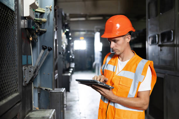 istock Power energy motor machinery cabinets in control or server room, operator station network and circuit center in industry factory system. Engineer man or worker, people working in electrical station 1346578237