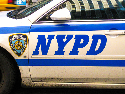 New York, USA - November 2009: Close up of the badge on the side of a New York police department patrol car