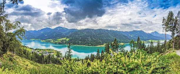 istock Panoramic view over turquoise lake Weissensee in Austrian province Carinthia during daytime 1346580306