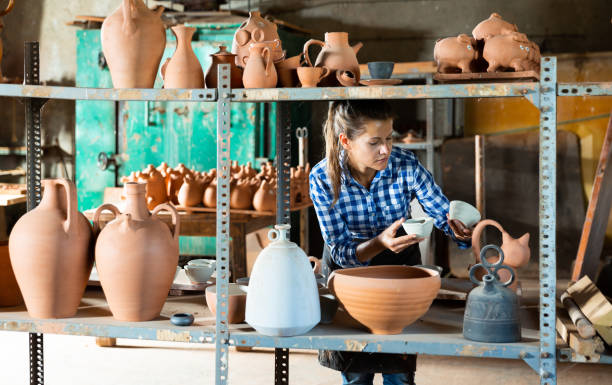 istock Female artisan inspecting finished production 1346580605