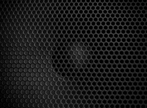 istock Protective decorative metal grill with honeycombs on modern acoustic systems. 1346582334