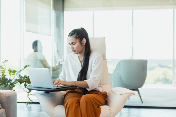 istock While manager works in background, secretary uses laptop 1346582451