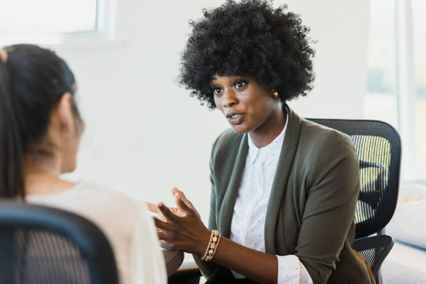 istock Mid adult woman interviews for position 1346582469