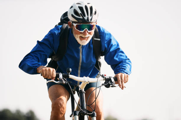 istock Active mature cyclist enjoying the ride in nature. 1346583534