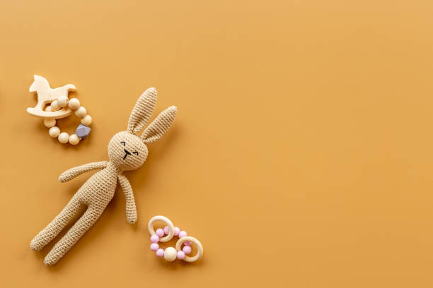 istock Baby toy rabbit with wooden accessories, overhead view 1346586532