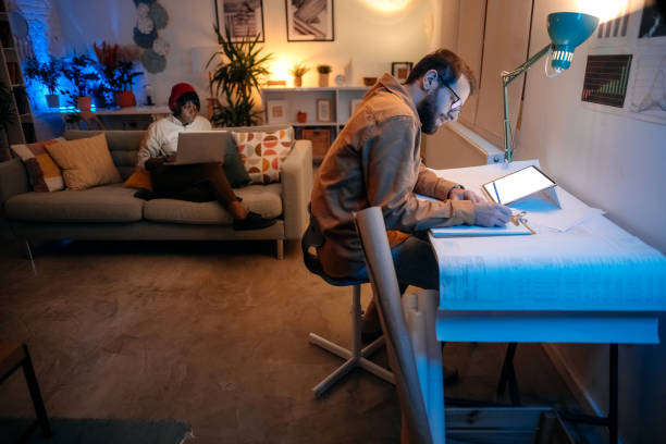 istock Couple working late from their apartmen 1346586817