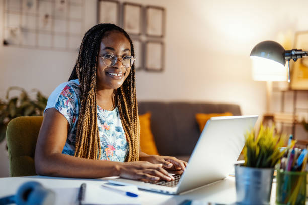 istock African American woman working and studying from home, looking at camera 1346588964