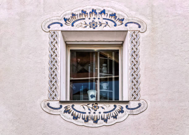 istock Traditional windows decoration at old house. 1346589062