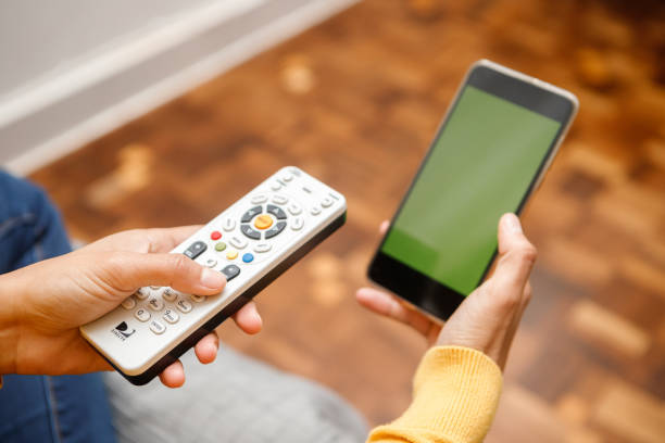 istock friends watching television together on the couch 1346593002