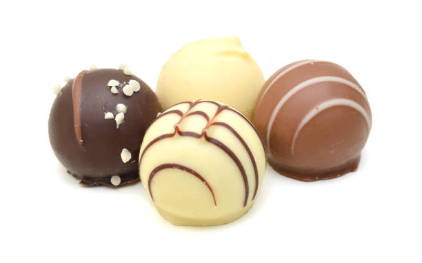 istock Chocolate candies collection. Beautiful Belgian truffles isolated on white background 1346593984