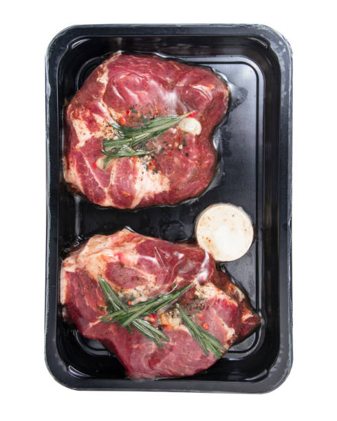 istock Fresh meat steak in vacuum pack plastic container isolated on the white background 1346595425