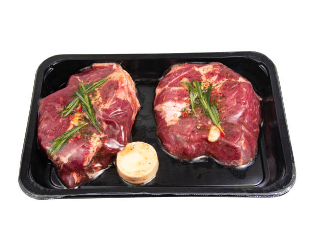 istock Fresh meat steak in vacuum pack plastic container isolated on the white background 1346595492