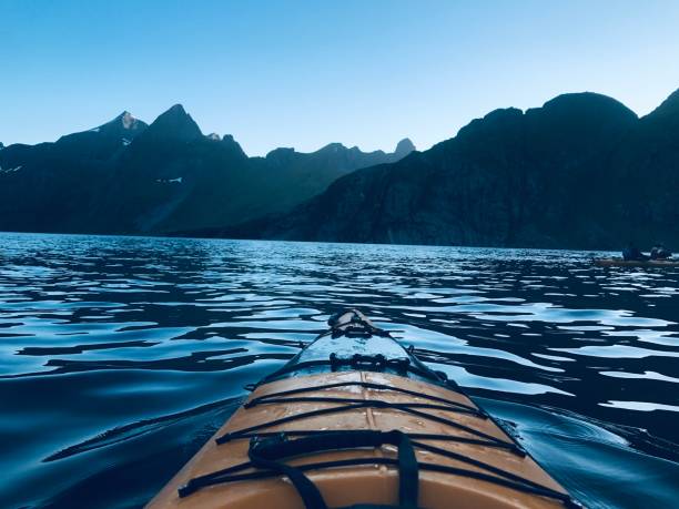 istock Midnight sun kayaking in the Lofoten Islands, Norway 1346596040