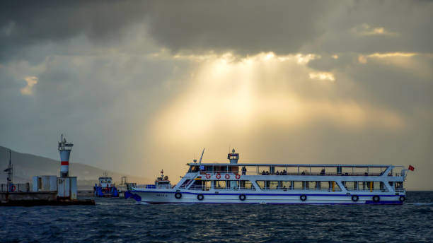 Daily life in autumn season during Covid-19 outbreak at Kordon Seaside. The people walk in the most known area of Izmir in a cloudy and rainy weather on October 12, 2021, Izmir, Turkey