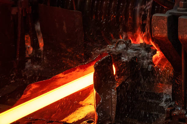 istock The red-hot metal bar is rolled on a rolling mill 1346598990