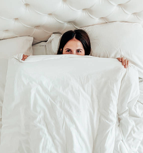 istock Woman hiding in the blanket 1346600018
