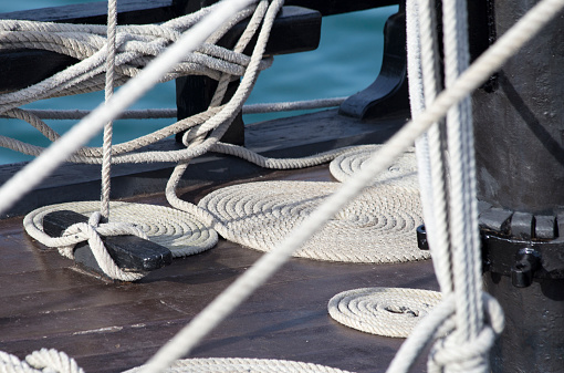 several boat ropes rolled up on the deck