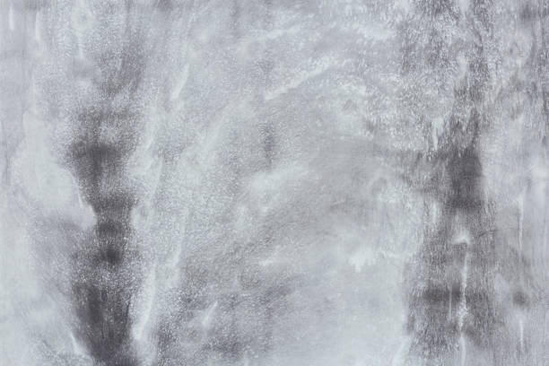 A smooth surface of a concrete formwork wall with various shades of grey, for background