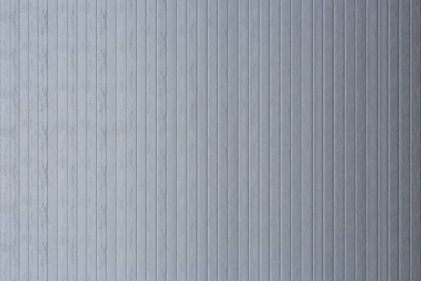 istock surface of several grey metal sheets in vertical position, for invitation or industrial style background 1346601785