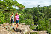Girls Standing On Rocky Overlook at State Park