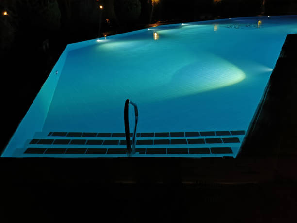 istock Outdoor pool illuminated night view 1346604642