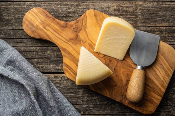 istock Block of hard cheese. Sliced cheese. 1346608865