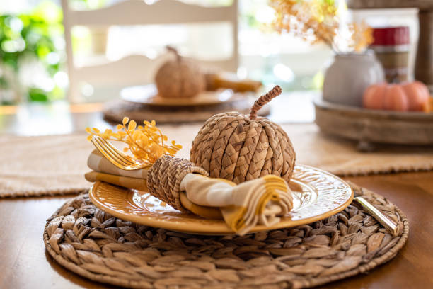 Stylish fall place setting in light and bright sunny dining room