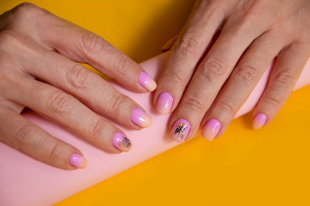 istock female hand beautiful manicure on color background 1346610505
